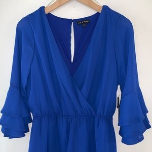 Blue romper with med length bell sleeves